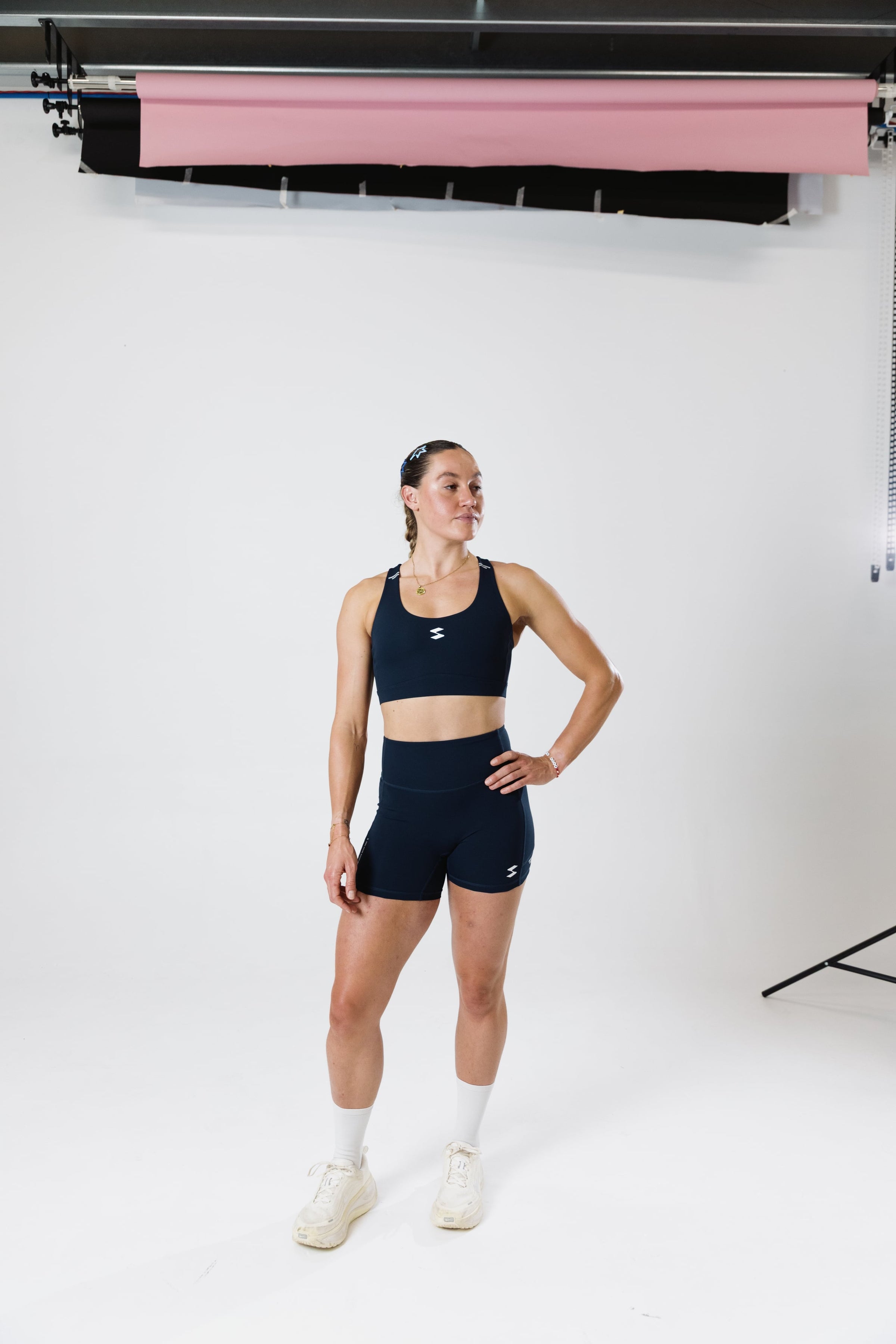 Runner wearing the SASH Navy Blue Motion Short and Perform Bra, front view